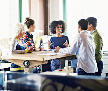 Group of coworkers discussing