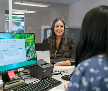 miling customer at reception