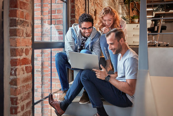 young business people sitting on stairs